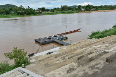 High angle view of boat in lake against sky