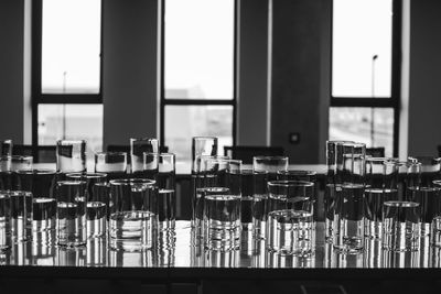 Close-up of glass on table by window