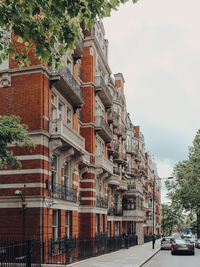 Building by street against sky