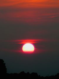Scenic view of silhouette landscape against romantic sky at sunset
