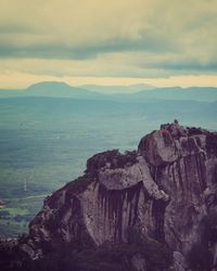 Rock formations on landscape against sky