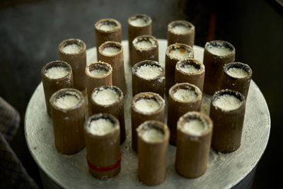 Putu bambu sale at street food market, indonesia traditional cake