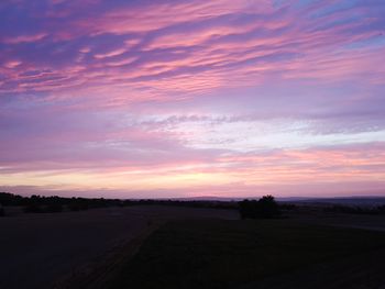 Scenic view of silhouette landscape against sky during sunset