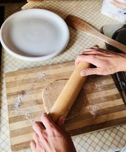 Midsection of person preparing food on table