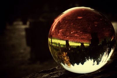 Close-up of crystal ball at night