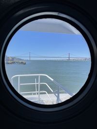 View of sea seen through window