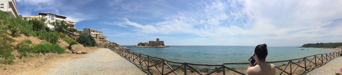 Panoramic view of sea against cloudy sky