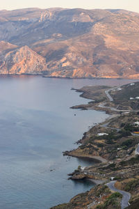 Scenic view of sea and mountains against sky