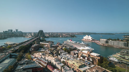 High angle view of city buildings against clear sky