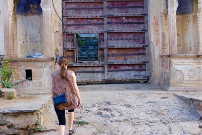 Woman standing in old building