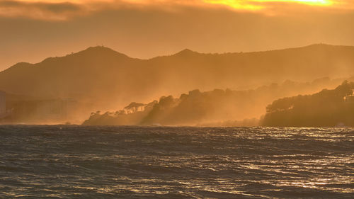 Scenic view of sea against sky during sunset