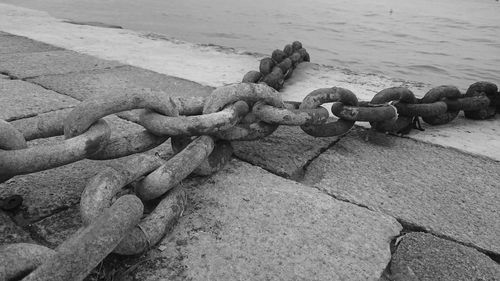 Close-up of chain on pier