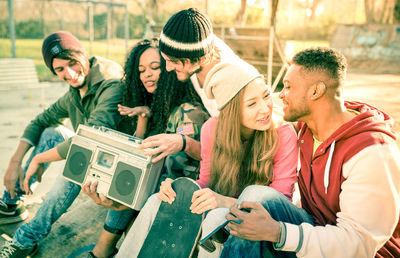 Rear view of people photographing outdoors