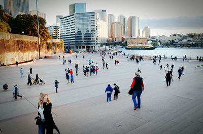 People in city against sky