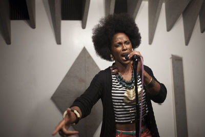 Singer performing in a recording studio