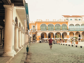 People walking in front of building