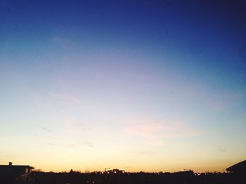 Scenic view of landscape against sky at sunset