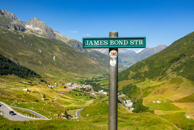 Close-up of road sign on field