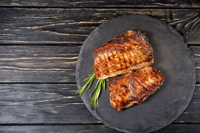 High angle view of meat on barbecue grill