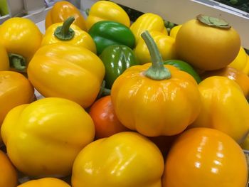 Close-up of yellow bell peppers for sale in market