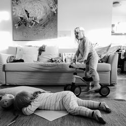 Women lying down on floor at home