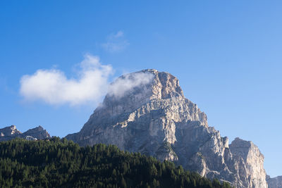 Scenic view of mountains against clear blue sky