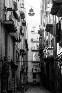 Empty alley amidst residential buildings