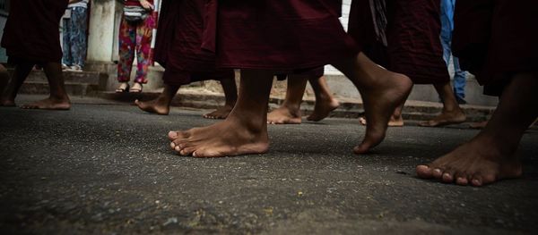 Low section of people walking