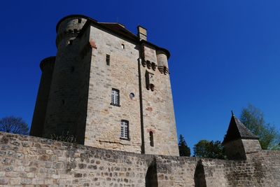 Low angle view of fort against blue sky