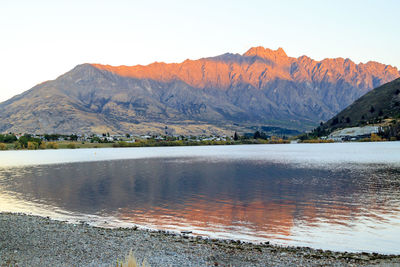 Scenic view of lake and mountains against sky