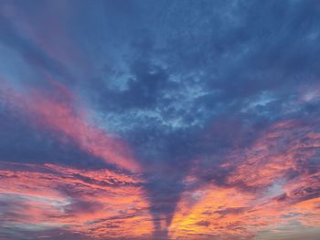 Low angle view of dramatic sky during sunset