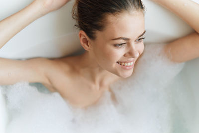 Portrait of young woman in bathroom