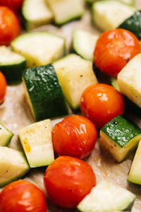 Roasted tomatoes and zucchini closeup