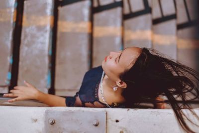 Portrait of a young woman with eyes closed