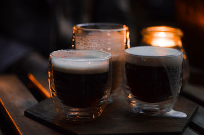 Close-up of cups with coffee on table