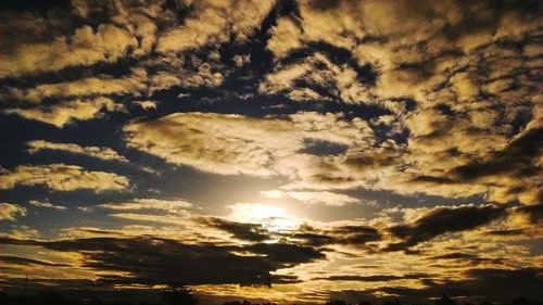 Low angle view of clouds in sky during sunset
