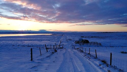 Scenic view of landscape against sky during winter