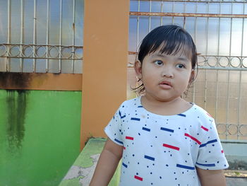 Portrait of cute girl standing outdoors