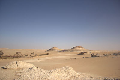 Scenic view of desert against clear sky