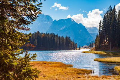 Scenic view of lake and mountains against sky