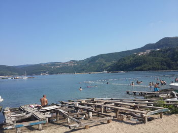 Scenic view of beach against clear sky