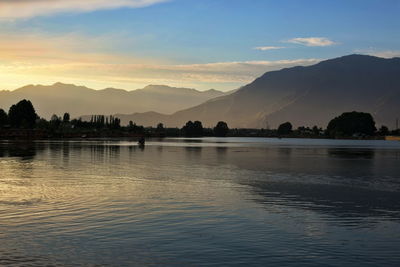 Scenic view of lake against sky during sunset