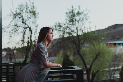 Woman looking away in balcony