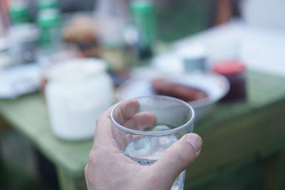 Close-up of hand holding drink