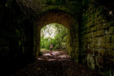 People walking in tunnel