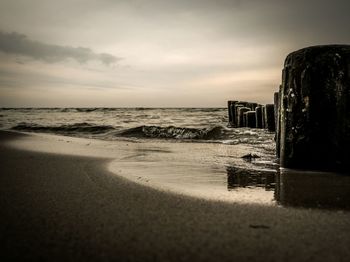 Scenic view of sea against cloudy sky