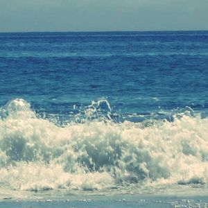 Scenic view of sea against blue sky