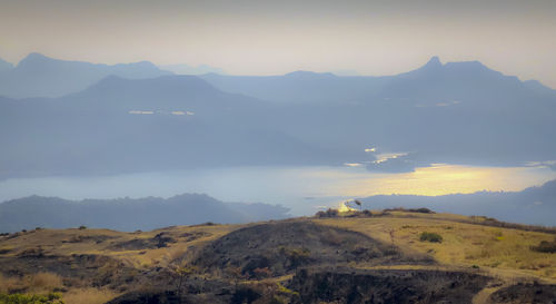 Scenic view of mountains against sky during sunset