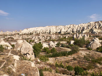 Rock formations on landscape against sky