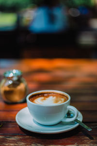 Close-up of coffee cup on table